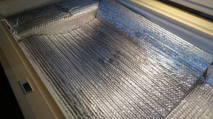 Food covered by reflective insulation in a chest freezer